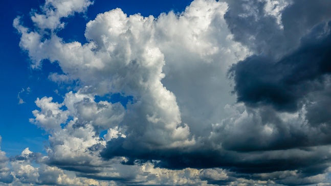 cumuluscloudsinsunlightandshadowonasummerafternoon