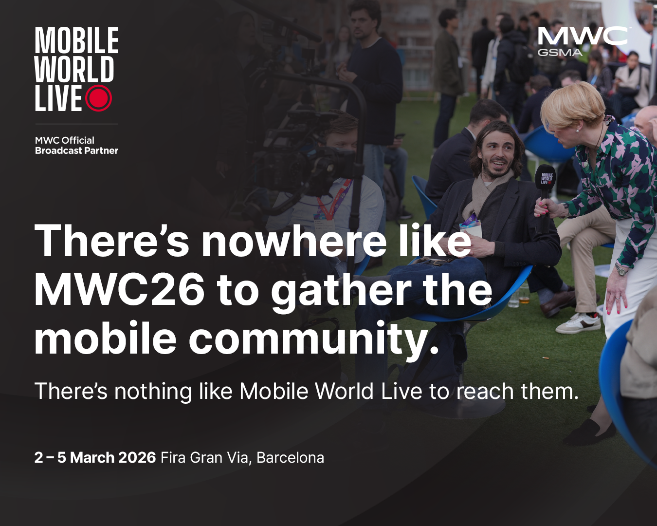 A woman interviews a man with a microphone in an outdoor setting at a tech event. People sit and stand in the background. The image promotes MWC26 in Barcelona, stating, “There’s nowhere like MWC26 to gather the mobile community.”.